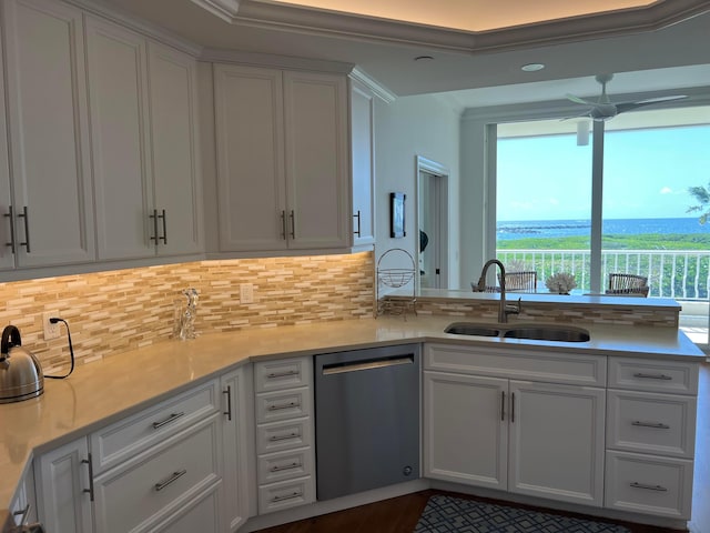 kitchen featuring ceiling fan, white cabinetry, backsplash, dishwasher, and sink