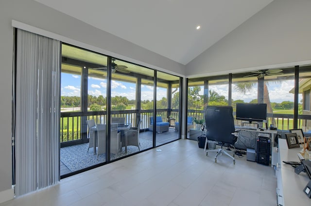 office space with light tile floors, ceiling fan, and high vaulted ceiling