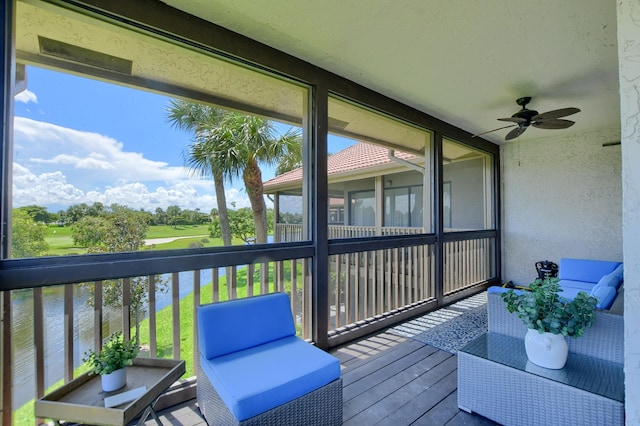 sunroom / solarium with plenty of natural light and ceiling fan