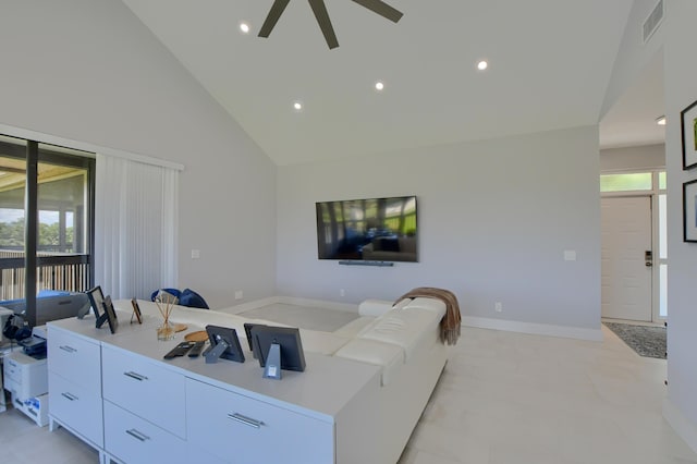 tiled living room featuring ceiling fan, high vaulted ceiling, and a wealth of natural light