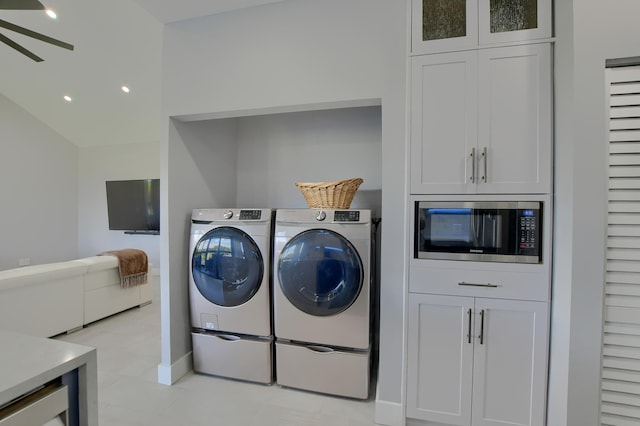 clothes washing area featuring light tile floors, independent washer and dryer, and ceiling fan