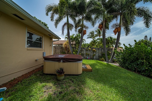 view of yard with a hot tub