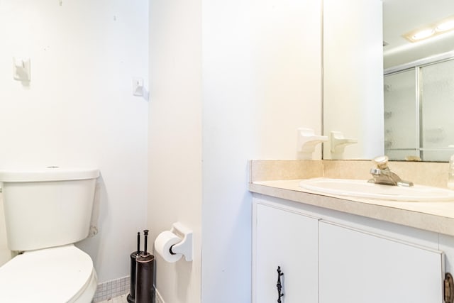 bathroom featuring toilet and vanity