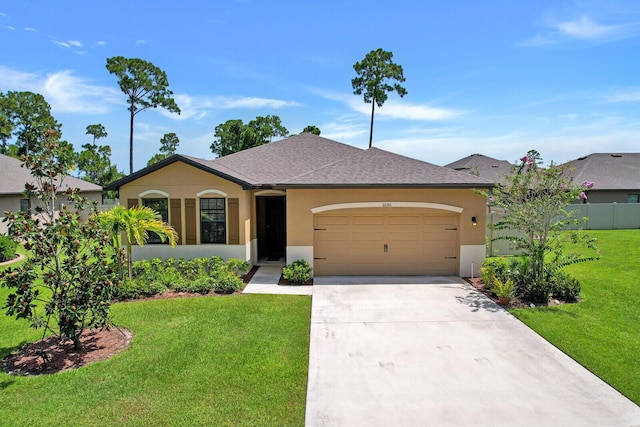 ranch-style home featuring a front lawn and a garage