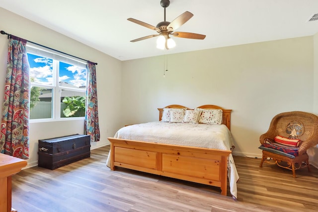 bedroom featuring ceiling fan and light wood-type flooring