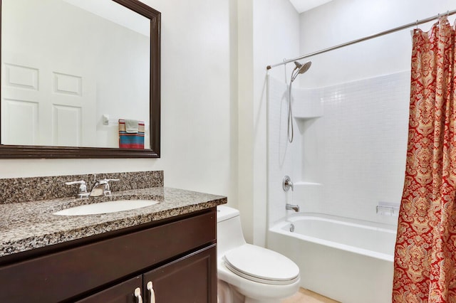 full bathroom featuring shower / bath combo, toilet, and vanity