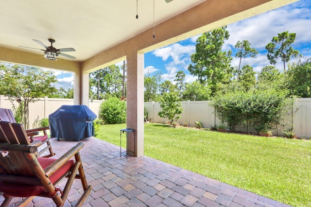 view of terrace featuring a grill and ceiling fan