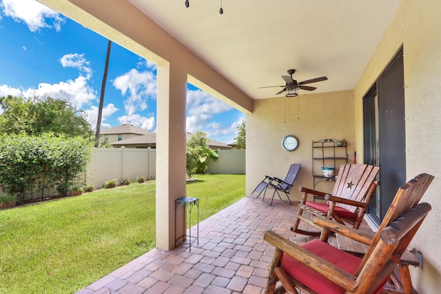 view of terrace featuring ceiling fan