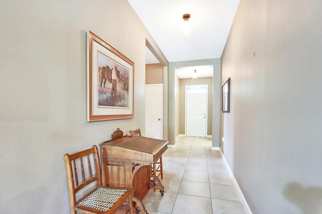 hall with light tile flooring