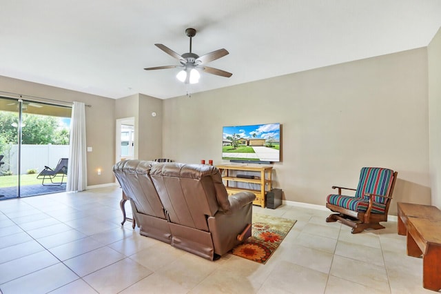 living room with light tile floors and ceiling fan