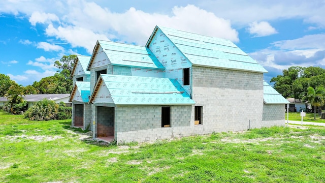 view of property exterior with a yard