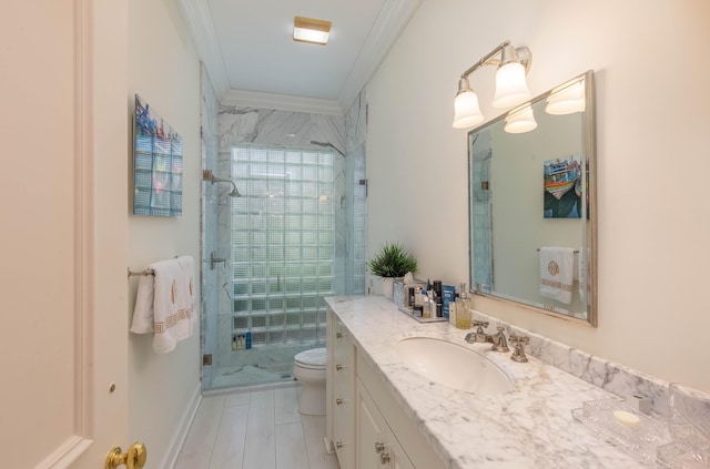 bathroom featuring toilet, large vanity, an enclosed shower, and crown molding