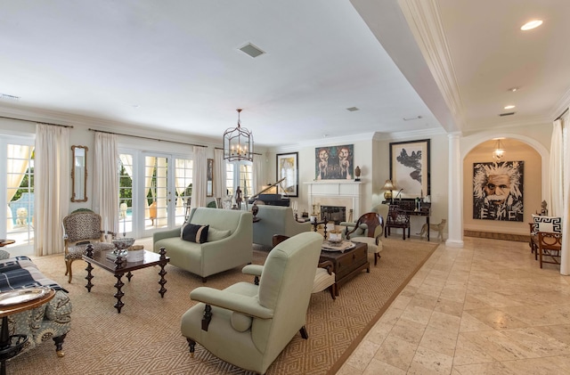 tiled living room with french doors, ornamental molding, a healthy amount of sunlight, and a chandelier