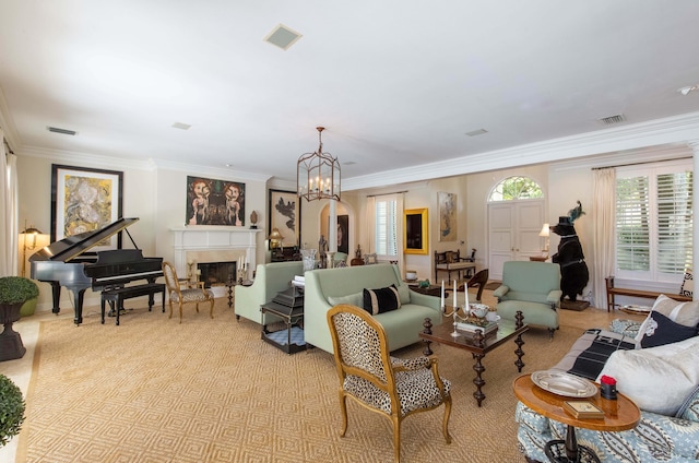 living room with a notable chandelier and crown molding