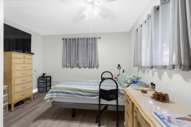 bedroom featuring light hardwood / wood-style floors and ceiling fan