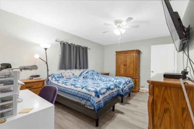 bedroom featuring ceiling fan and light wood-type flooring