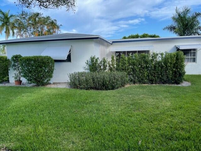 view of home's exterior featuring a yard