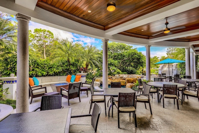 view of patio featuring ceiling fan and an outdoor living space