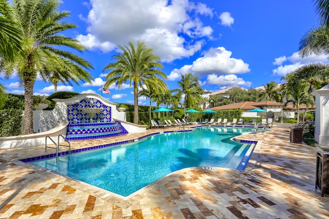 view of swimming pool featuring a patio area