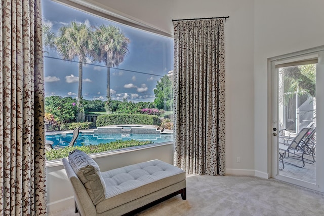 living area with light colored carpet