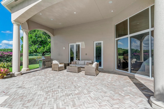 view of patio with exterior kitchen and outdoor lounge area