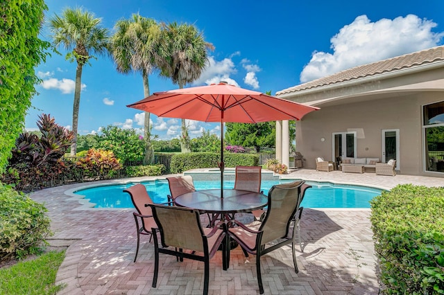 view of swimming pool with outdoor lounge area and a patio area