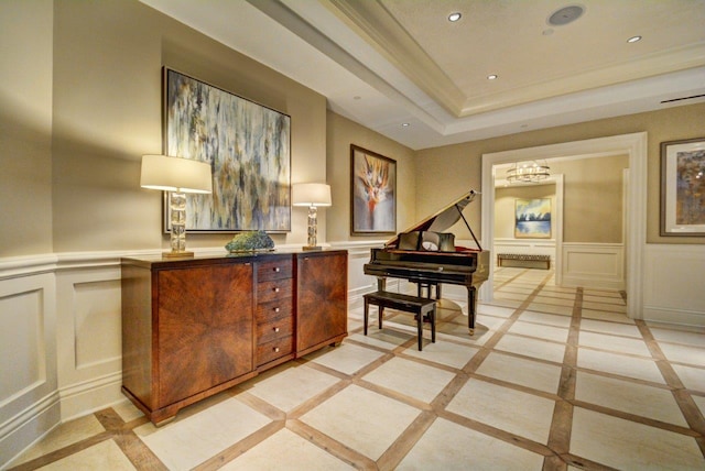 interior space featuring a chandelier, a tray ceiling, and light tile flooring