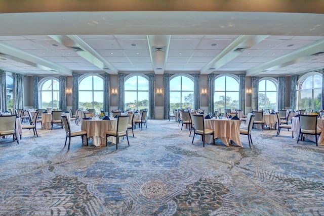 dining room with a drop ceiling and carpet floors