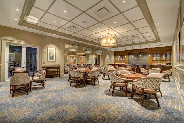 dining room featuring coffered ceiling, carpet floors, and a tray ceiling