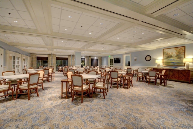 carpeted dining space featuring coffered ceiling, french doors, and beamed ceiling