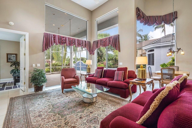 living room featuring light tile floors and a high ceiling