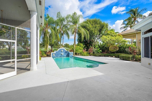 view of swimming pool with a patio area