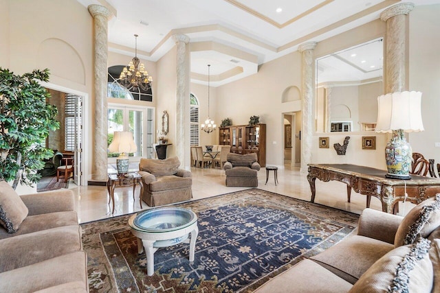 living room with an inviting chandelier, decorative columns, light tile floors, and a high ceiling