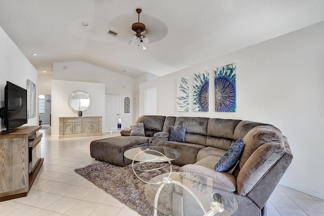 living room featuring vaulted ceiling, ceiling fan, and light tile floors