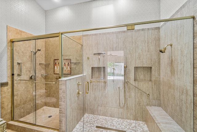 bathroom with a shower with shower door