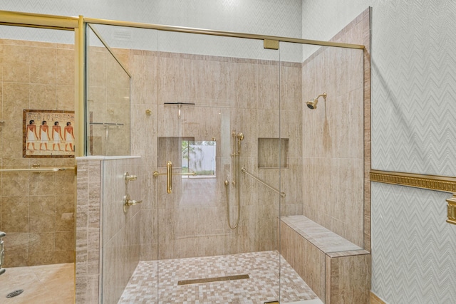 bathroom with a shower with door