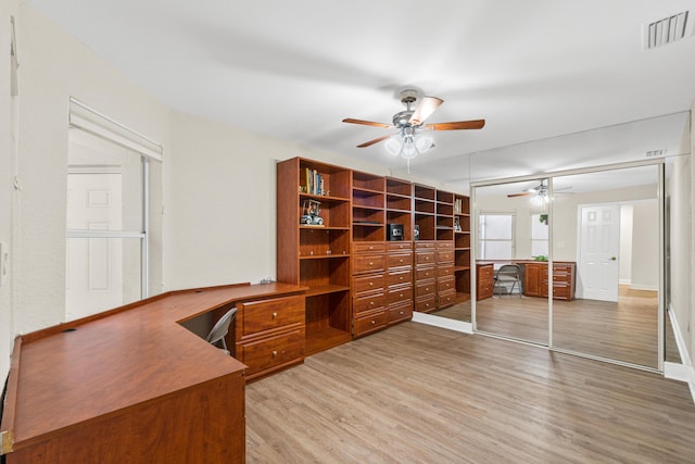 office area with ceiling fan and hardwood / wood-style flooring