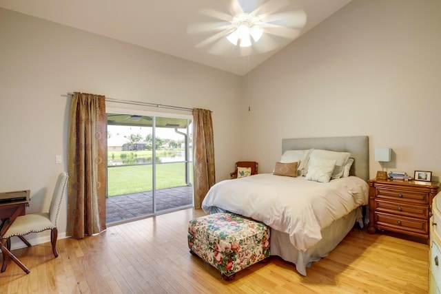 bedroom with light hardwood / wood-style flooring, ceiling fan, vaulted ceiling, and access to outside