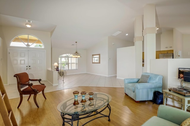 living room with lofted ceiling and light wood-type flooring