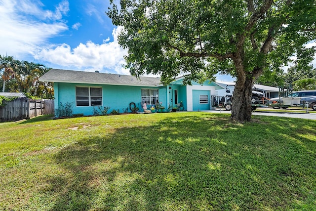 ranch-style house featuring a front lawn