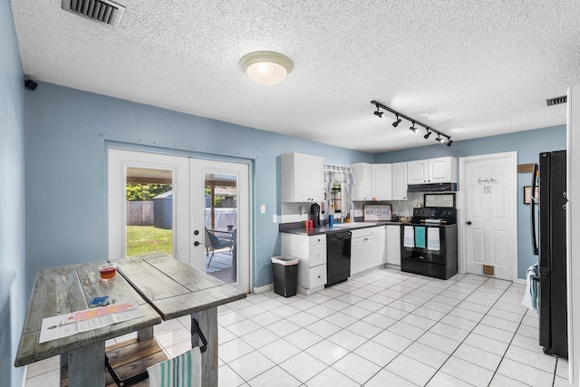 kitchen featuring french doors, rail lighting, light tile flooring, black appliances, and white cabinetry