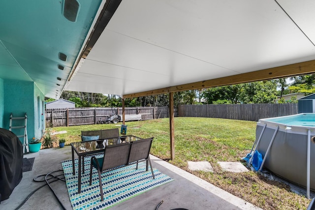 view of terrace with a fenced in pool