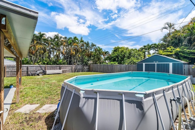 view of pool featuring a yard