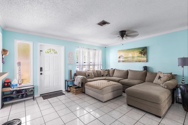 living room with light tile flooring, ceiling fan, and a textured ceiling