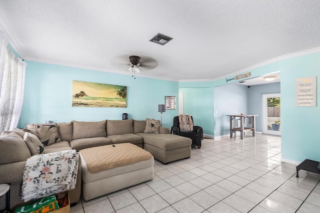 tiled living room with a textured ceiling, ceiling fan, and ornamental molding