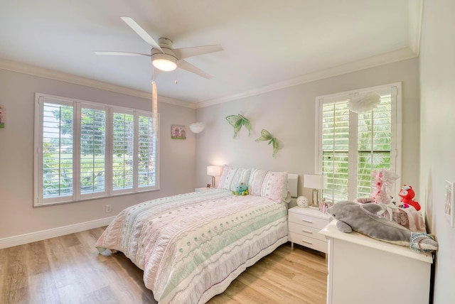 bedroom featuring multiple windows, ceiling fan, ornamental molding, and light wood-type flooring