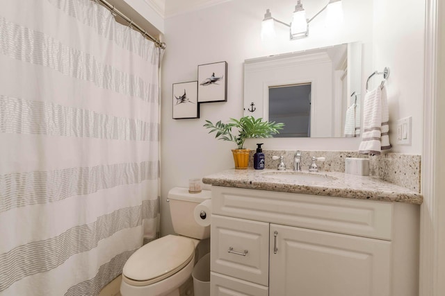 bathroom with vanity, toilet, and walk in shower