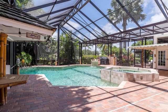 view of pool featuring an in ground hot tub, french doors, a lanai, and a patio area