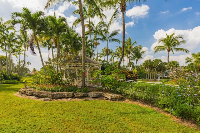 view of home's community with a lawn and a gazebo