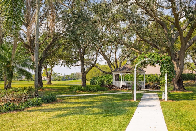 surrounding community featuring a gazebo and a lawn